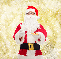 Image showing santa claus with glass of milk and cookies