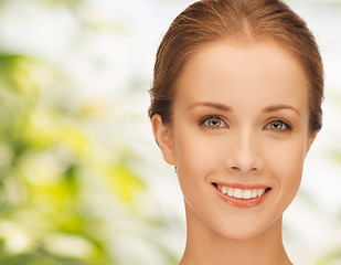 Image showing beautiful young woman over green background