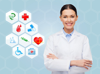 Image showing smiling doctor over medical icons blue background