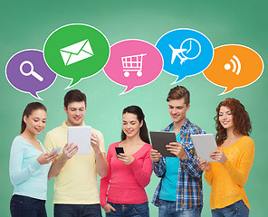 Image showing group of teenagers with smartphones and tablet pc