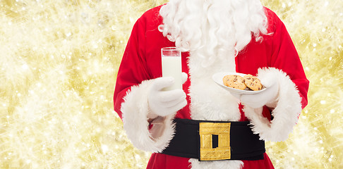 Image showing santa claus with glass of milk and cookies