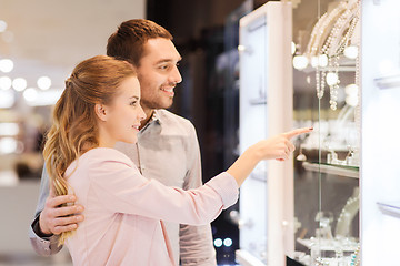 Image showing couple looking to shopping window at jewelry store