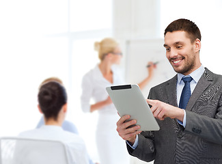 Image showing young businessman showing thumbs up gesture