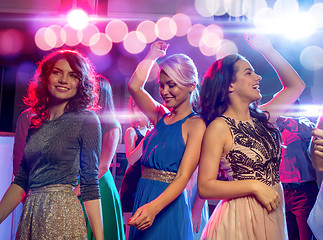 Image showing smiling friends dancing in club