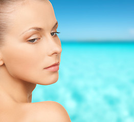 Image showing beautiful young woman over blue sky and sea