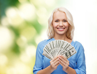 Image showing smiling young woman with us dollar money