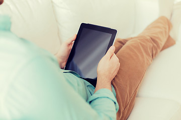 Image showing close up of man with tablet pc computer at home