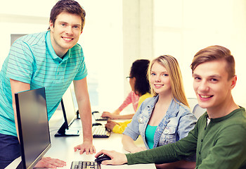 Image showing group of smiling students in computer class