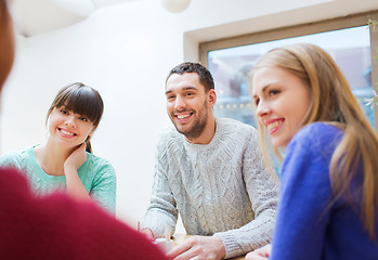 Image showing group of happy friends meeting and talking