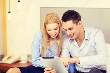 Image showing couple with tablet pc computer in hotel room