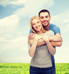 Image showing smiling couple hugging