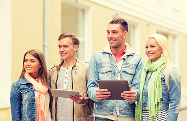 Image showing group of smiling friends with tablet pc computers