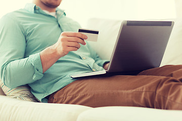 Image showing close up of man with laptop and credit card