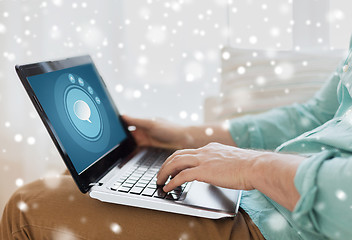 Image showing close up of man working with laptop at home