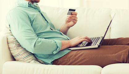 Image showing close up of man with laptop and credit card