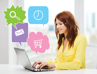 Image showing smiling woman with laptop computer at home