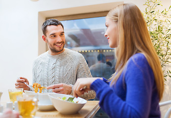 Image showing happy couple meeting and having dinner at cafe