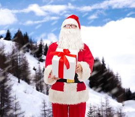 Image showing man in costume of santa claus with gift box