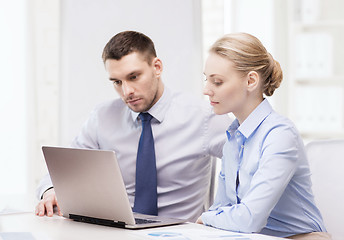 Image showing business team working with laptop in office