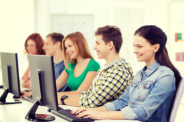 Image showing female student with classmates in computer class