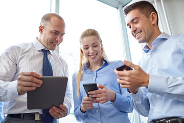 Image showing business people with tablet pc and smartphones