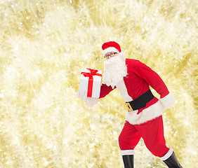 Image showing man in costume of santa claus with gift box