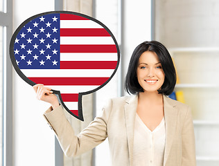 Image showing smiling woman with text bubble of american flag