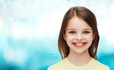 Image showing smiling little girl over white background