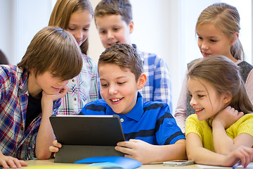 Image showing group of school kids with tablet pc in classroom