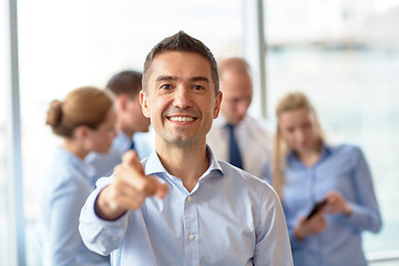 Image showing group of smiling businesspeople meeting in office