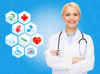 Image showing smiling doctor over medical icons blue background