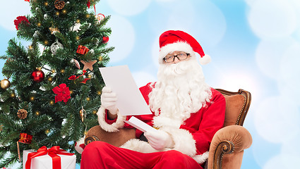 Image showing man in costume of santa claus with letter