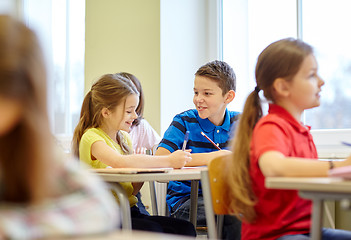 Image showing group of school kids writing test in classroom