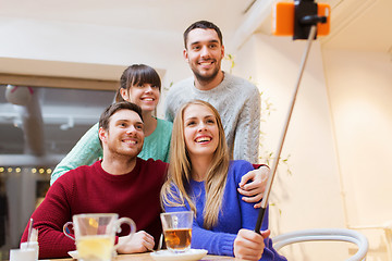 Image showing group of friends taking selfie with smartphone