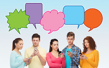 Image showing group of serious teenagers with smartphones