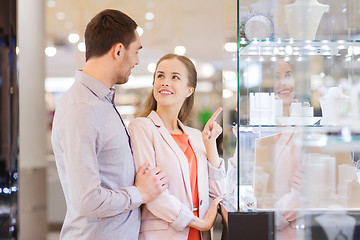 Image showing couple looking to shopping window at jewelry store