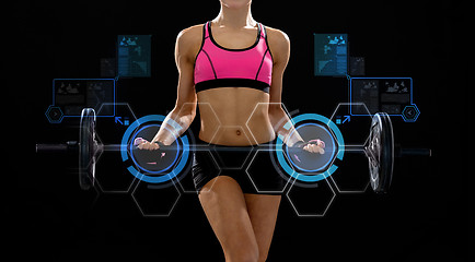 Image showing sporty woman exercising with barbell