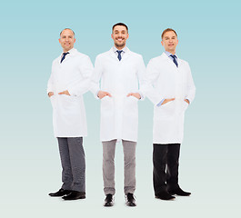 Image showing smiling male doctors in white coats