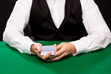 Image showing holdem dealer with playing cards