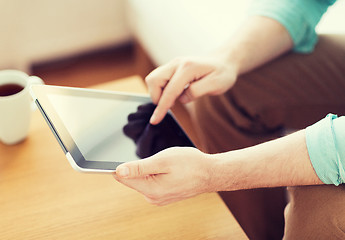 Image showing close up of man with laptop and cup at home