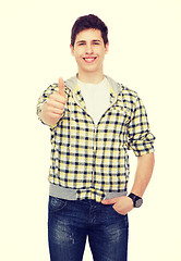 Image showing smiling student boy showing thumbs up