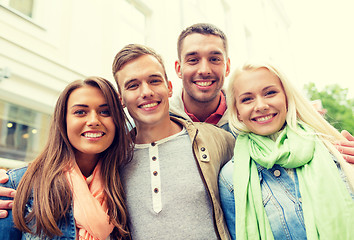 Image showing group of smiling friends in city