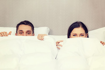 Image showing happy couple sleeping in bed