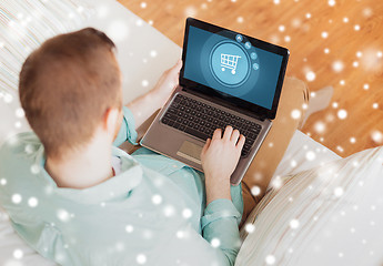 Image showing close up of man working with laptop at home