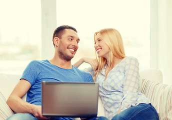 Image showing smiling happy couple with laptop at home