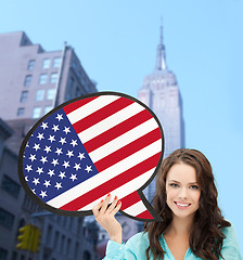 Image showing smiling woman with text bubble of american flag