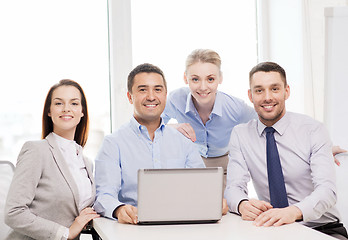 Image showing business team working with laptop in office