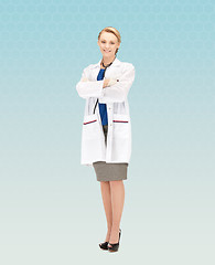 Image showing smiling young female doctor in white coat