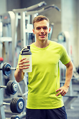 Image showing smiling man with protein shake bottle