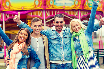 Image showing group of smiling friends showing thumbs up